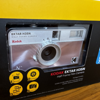 Kodak Ektar H35N 35mm half-frame film camera in glazed pink, with Kodak Ultramax film