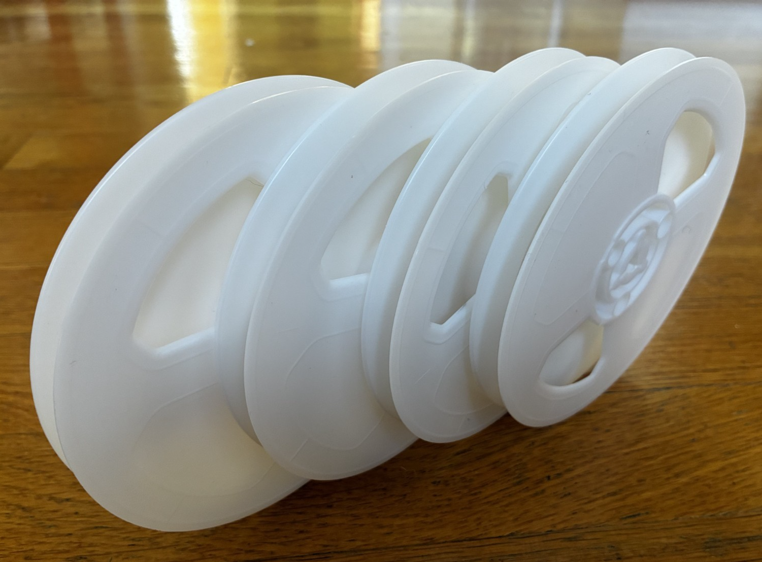 Regular 8mm 200ft white plastic movie film reels, pack of 4