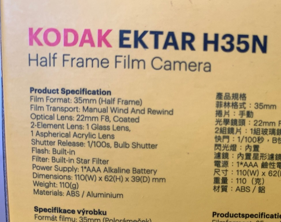 Kodak Ektar H35N 35mm half-frame film camera in glazed blue, with film and filters