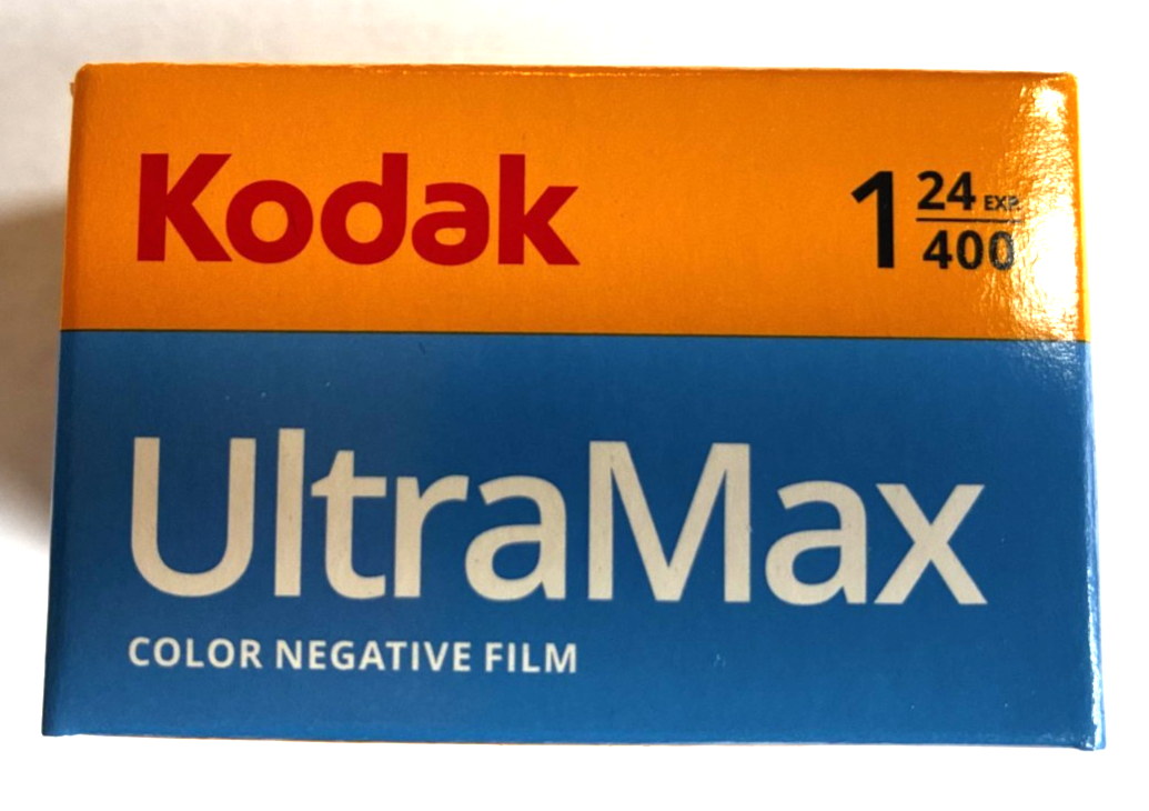 Kodak Ektar H35N 35mm half-frame film camera in glazed blue, with film and filters